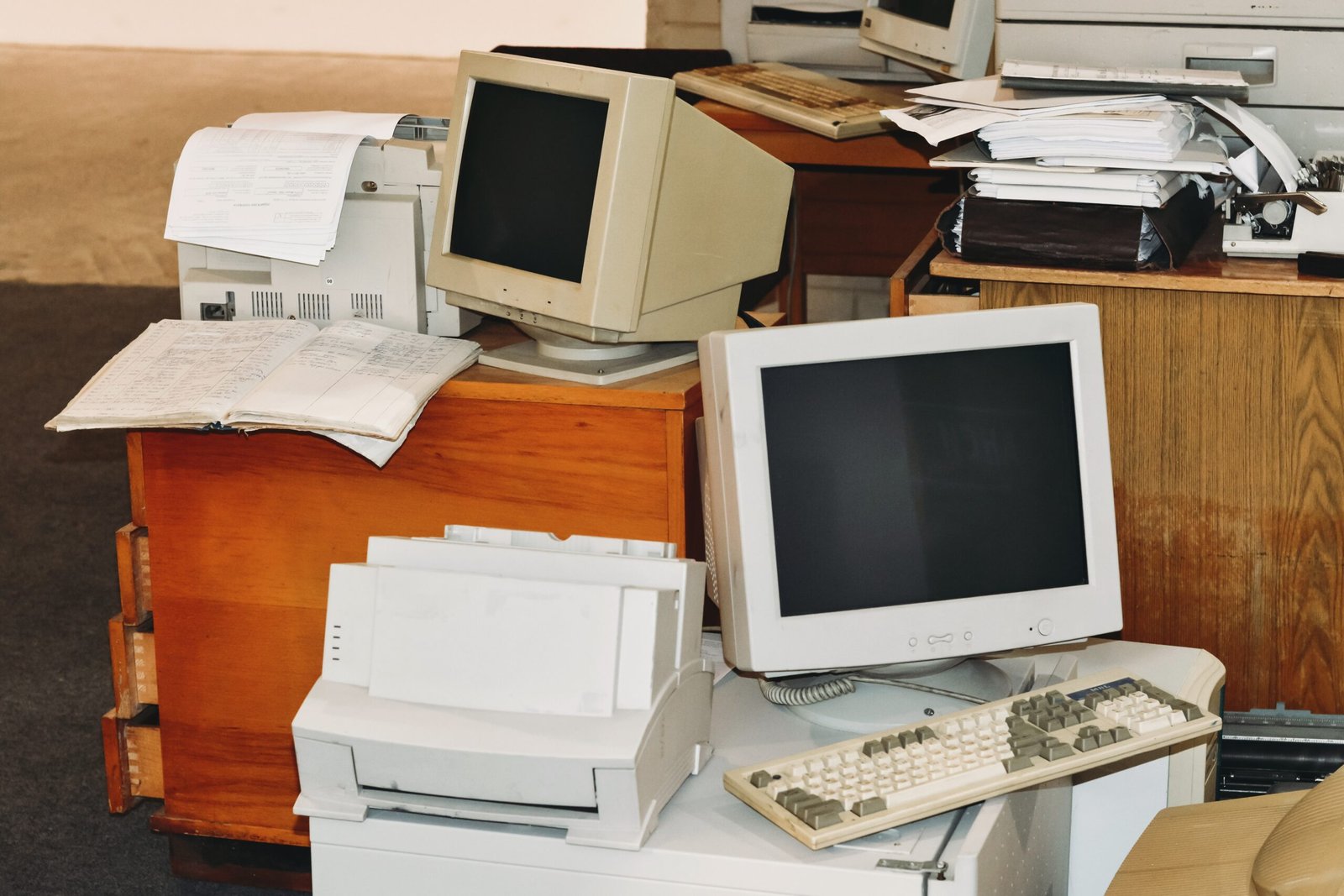 Old office equipment and furniture ready for office clearance