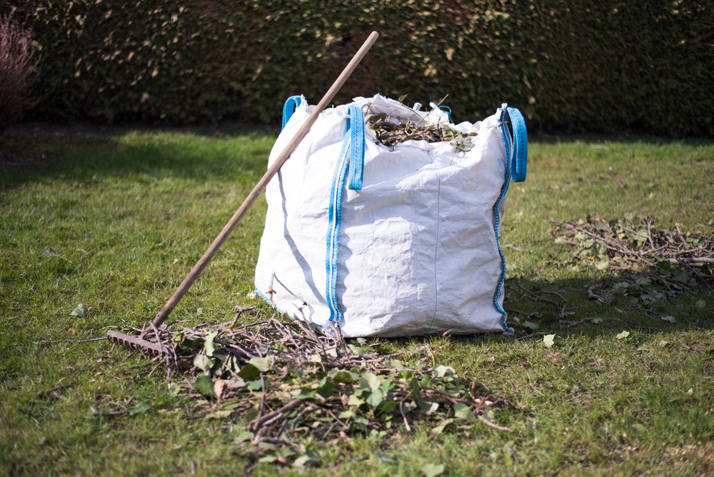 Garden waste bag with branches and cuttings after garden clearance
