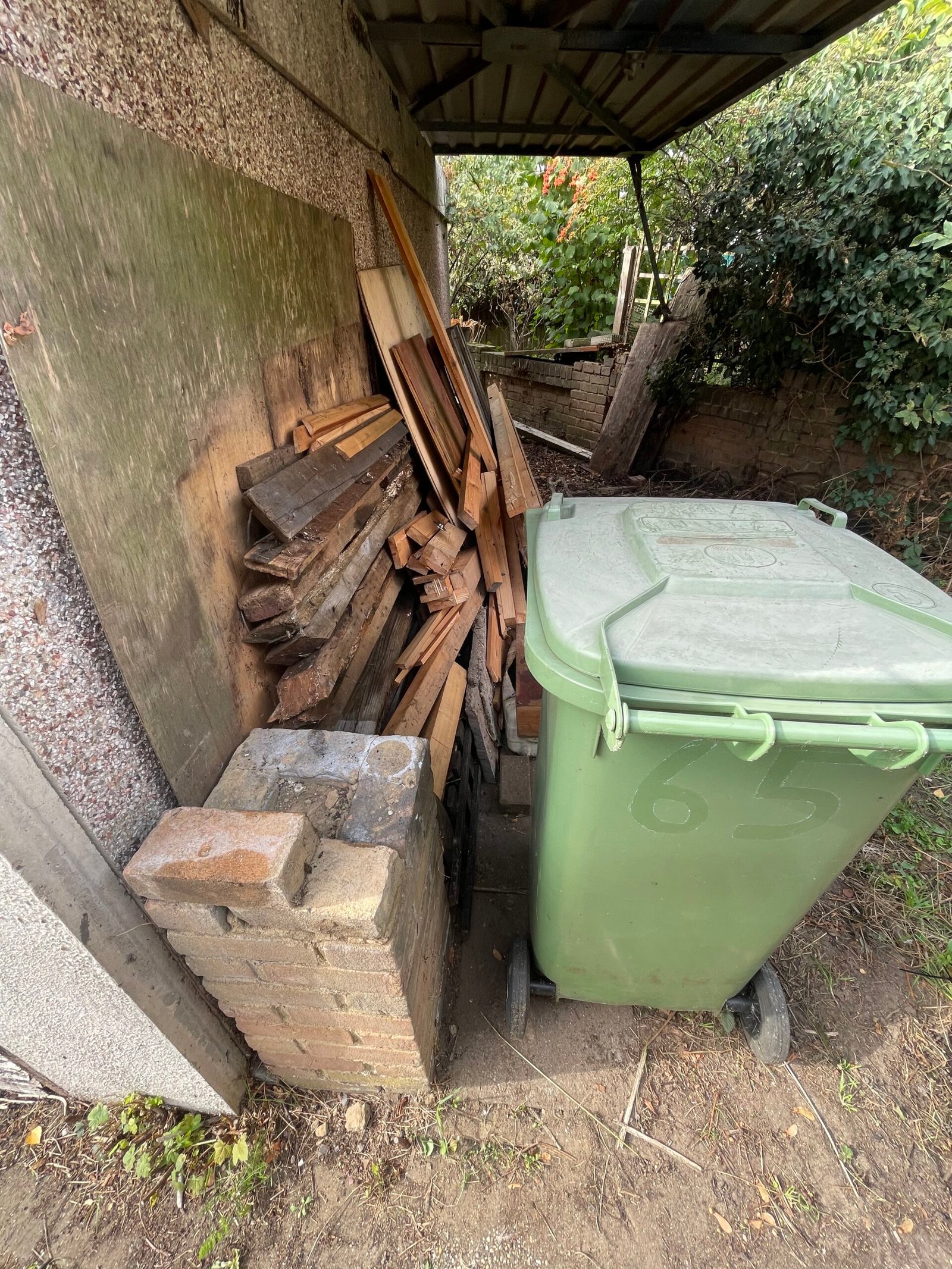 Wooden waste close to wall